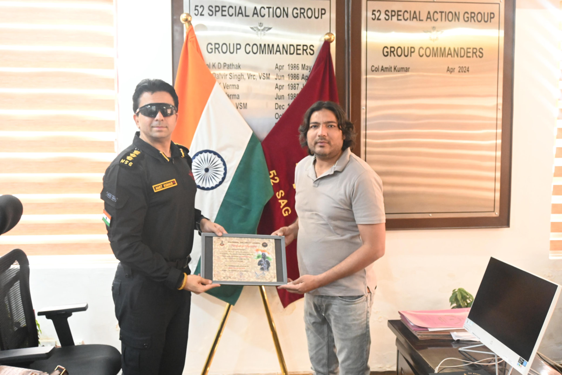 NS Furniture receiving a certificate of recognition from the 52 Special Action Group commander