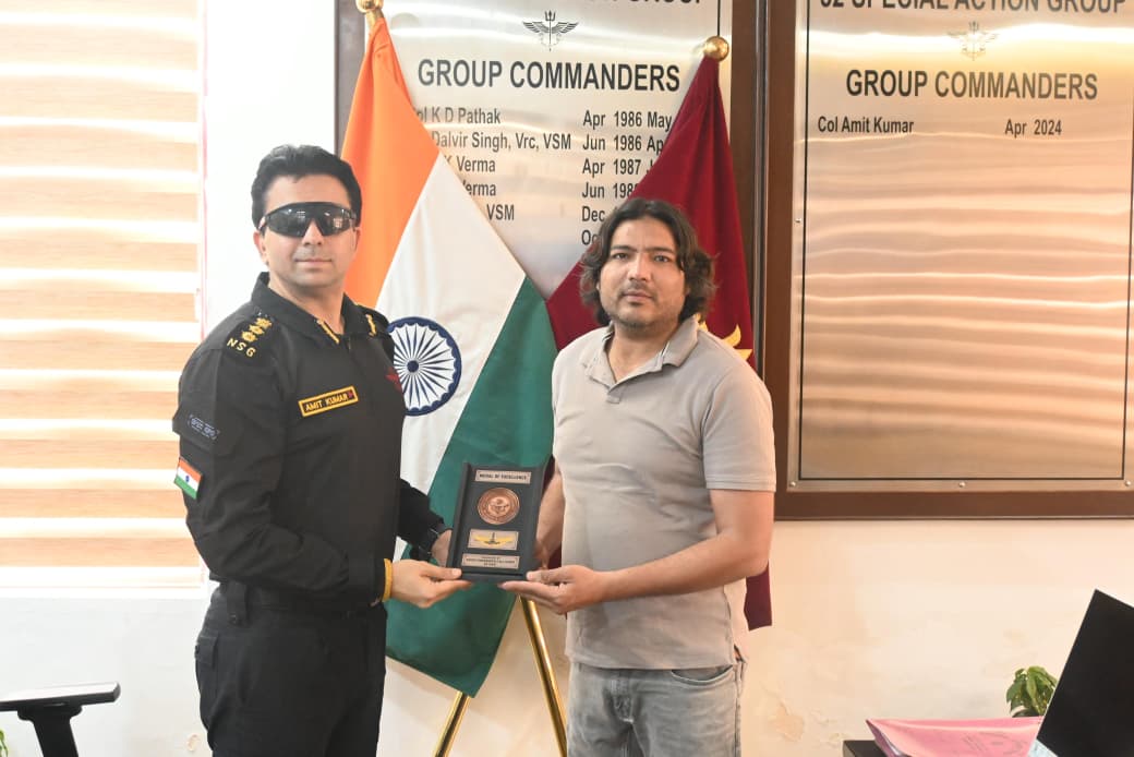 NS Furniture receiving a recognition plaque from the 52 Special Action Group commander